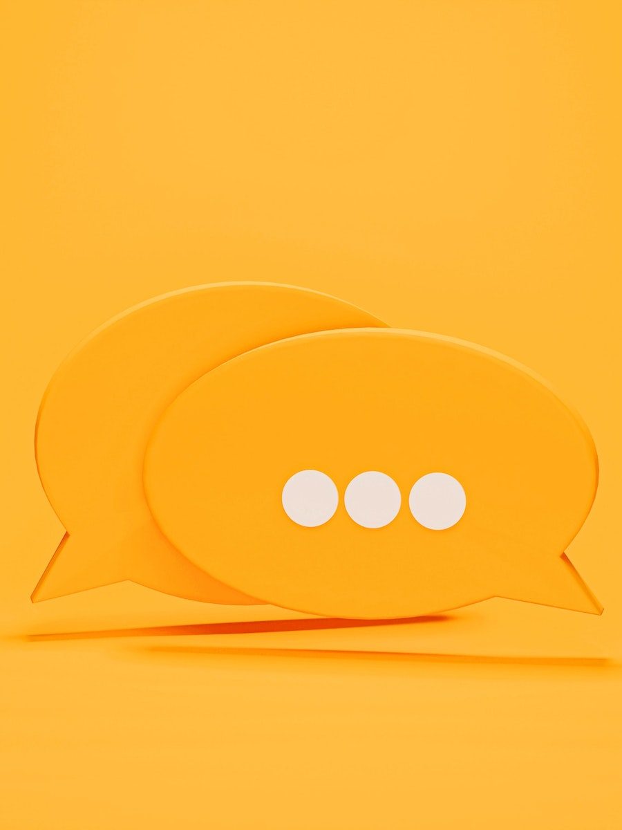 the conversation bubble of a yellow color is the symbol of communication and feedback